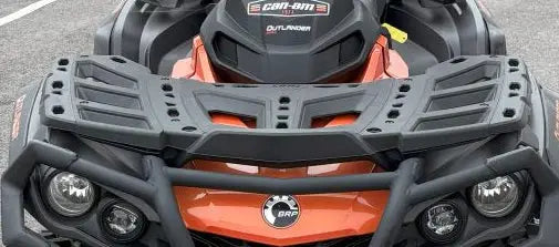 Orange and black can am outlander atv with rugged front bumper and protective grille shown with radiator relocation kit