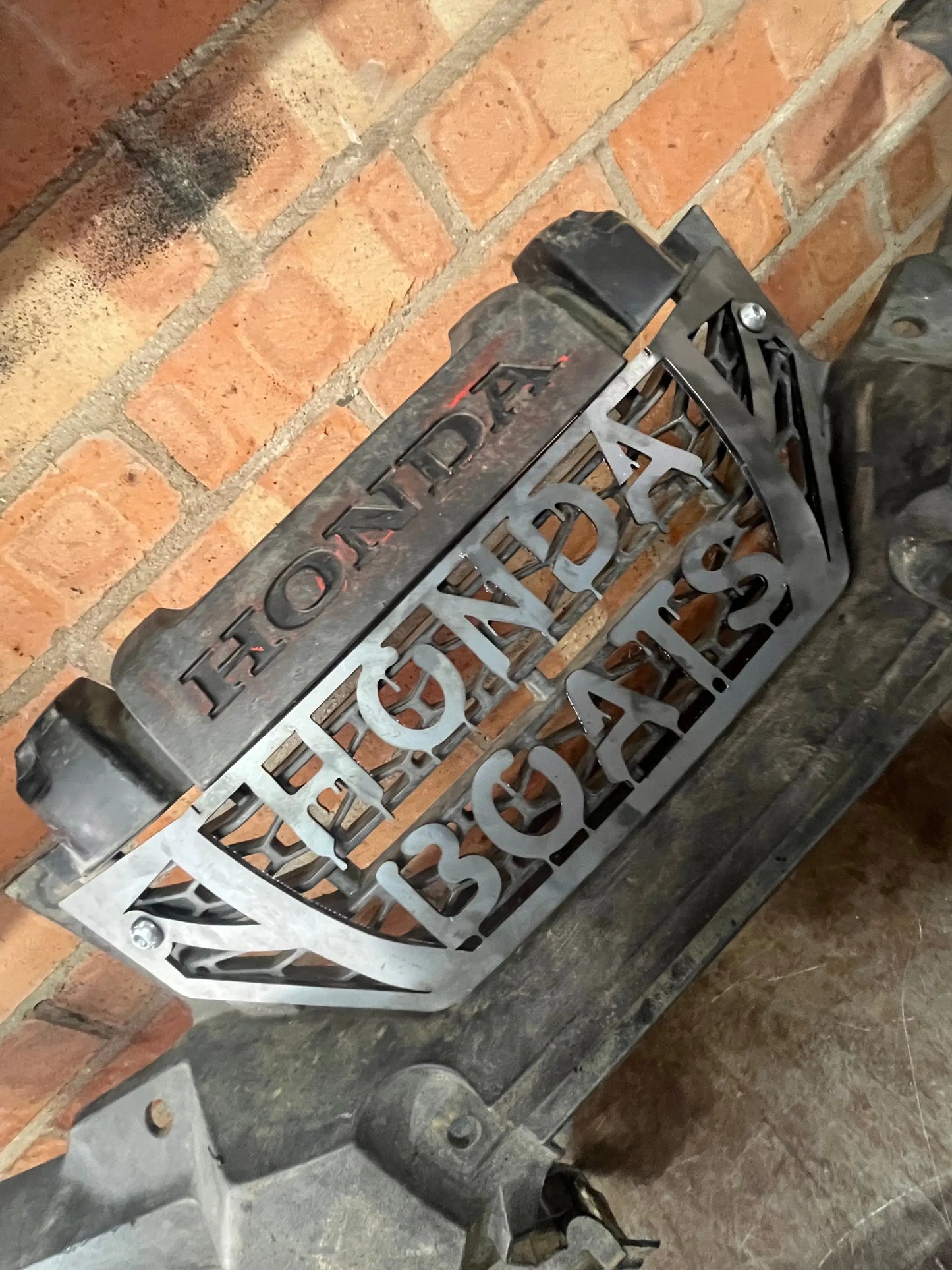 Silver metal honda trx 420 2014+ custom heavy-duty front grille cover with cut-out lettering and black plastic trim