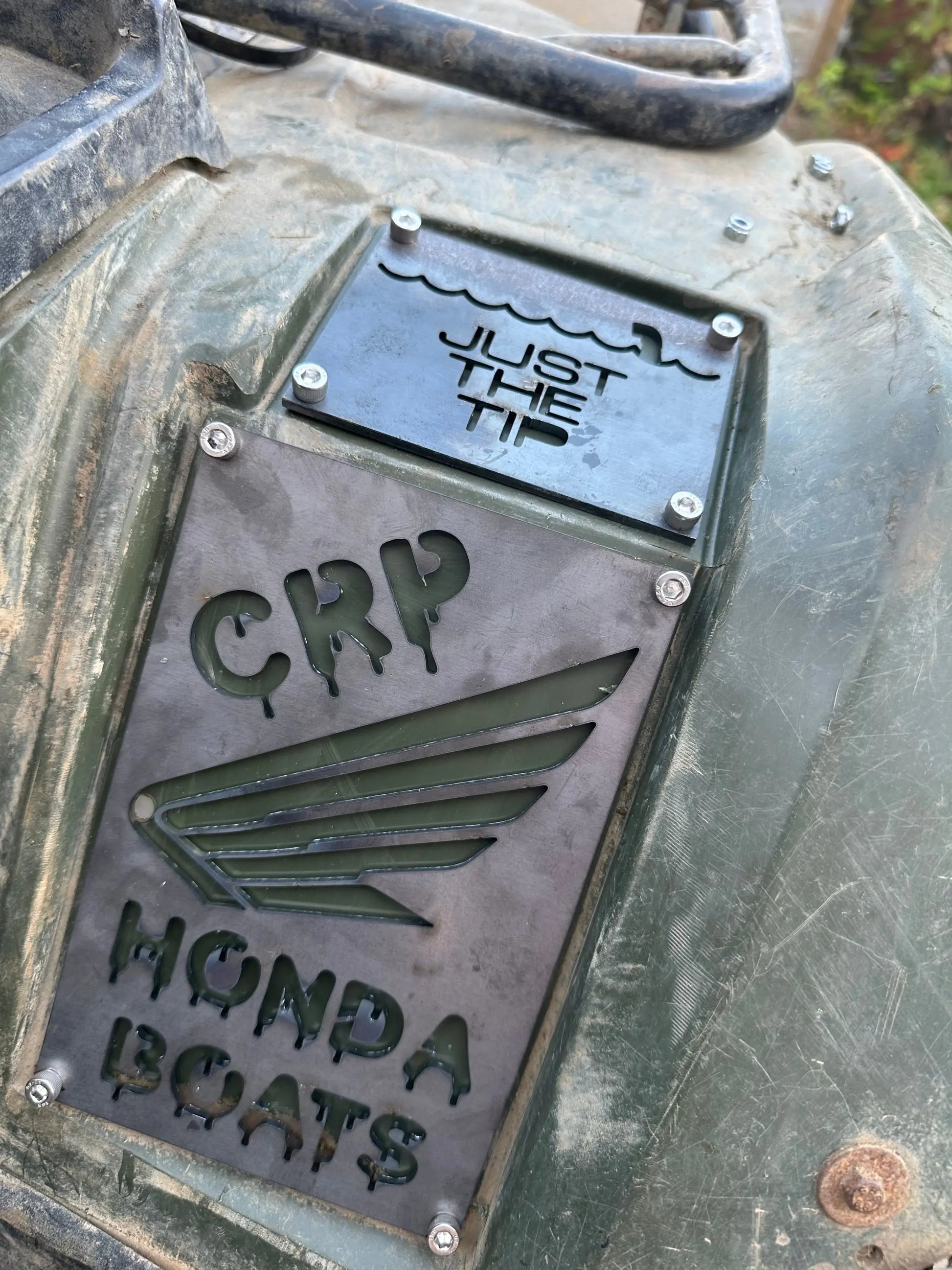 Dark gray metal Honda custom 3mm fender safety plate with crp and wing design mounted on ATV