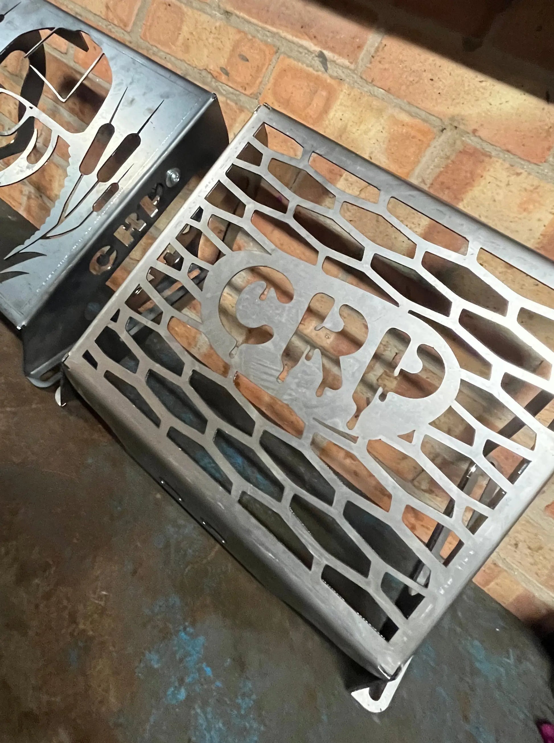 Silver metal grill grate with intricate geometric cutouts and grp logo for honda foreman 420 500 520 radiator kit