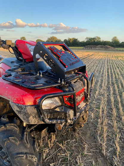 Black metal rear rack with red laser-cut honda logo mounted on red atv for honda foreman radiator relocation kit
