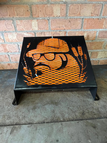 Black metal fire pit with orange mesh featuring a stylized duck wearing sunglasses and a hat for honda foreman radiator kit