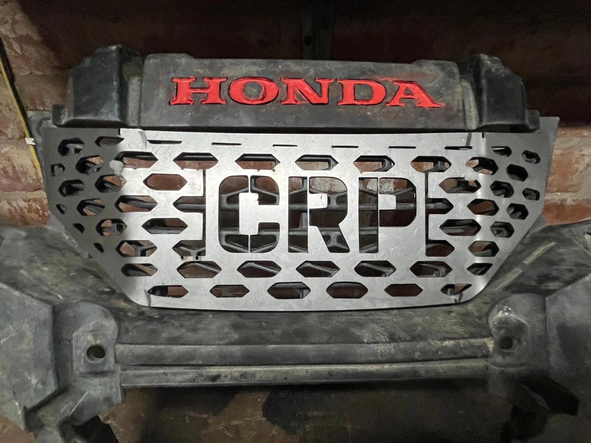 Silver metallic heavy-duty front grille cover with crp cutout and red honda logo for honda trx 420 2014+