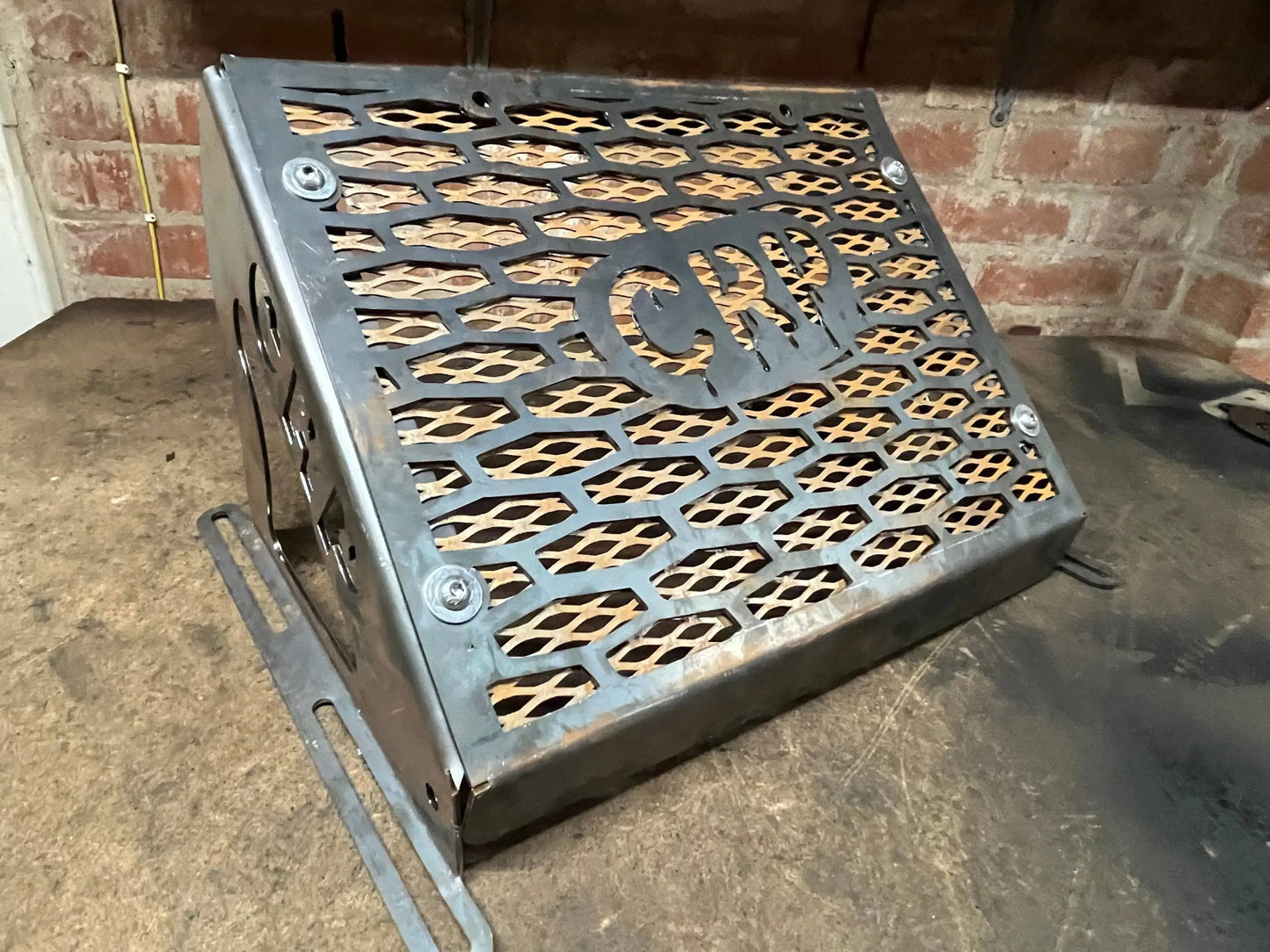 Black metal grill with honeycomb pattern and cwr cutout for kawasaki brute force 750 radiator relocation kit