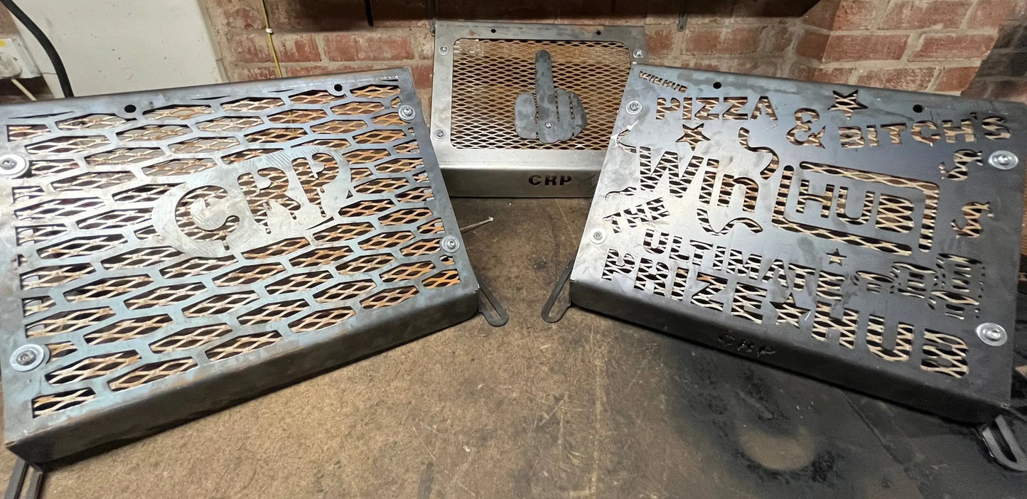 Three metallic laser-cut grill covers with engraved designs and crp branding for kawasaki brute force 750 radiator kit
