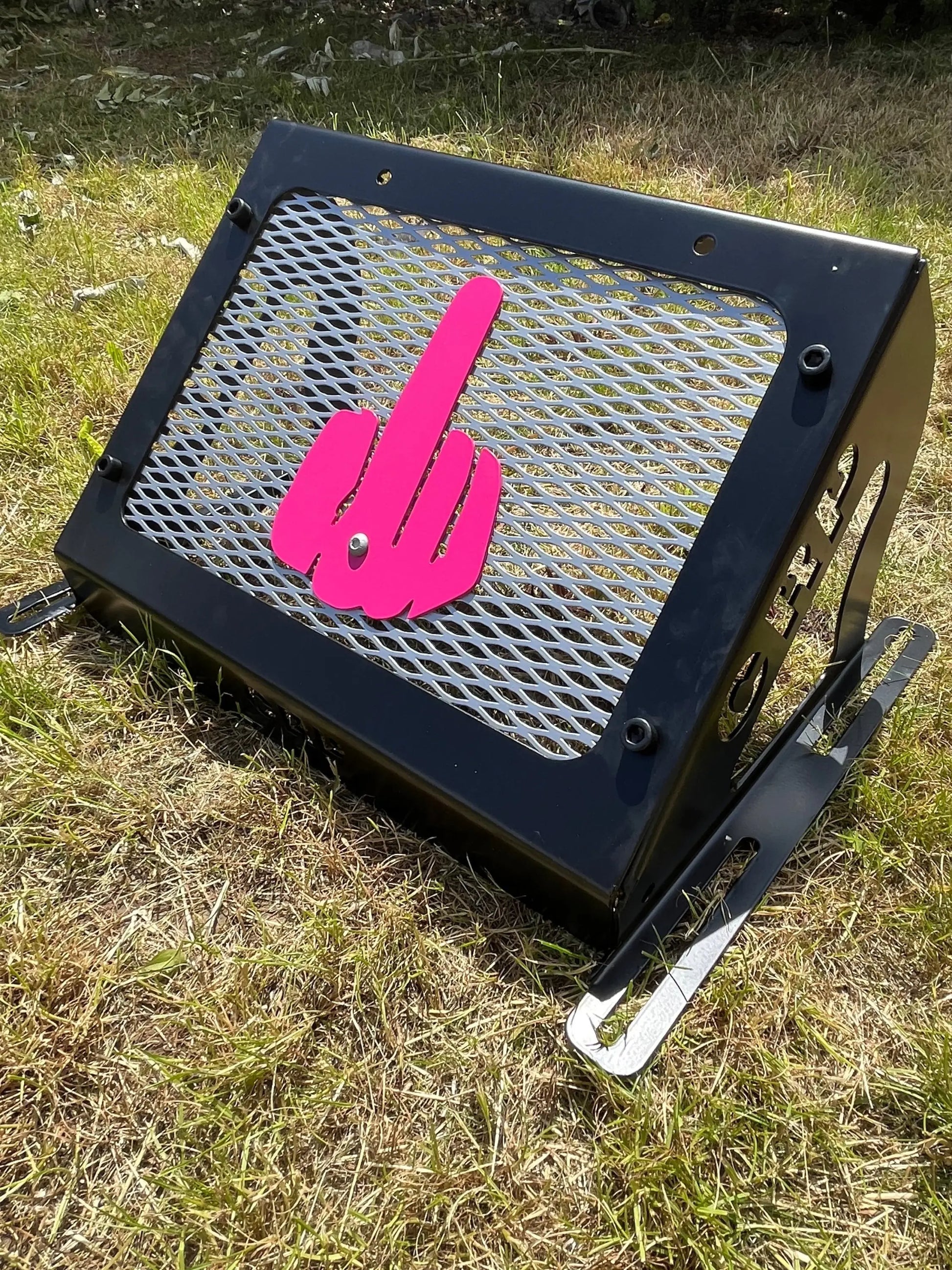 Black metal grill with bright pink hand gesture cutout for kawasaki brute force 750 heavy-duty radiator relocation kit