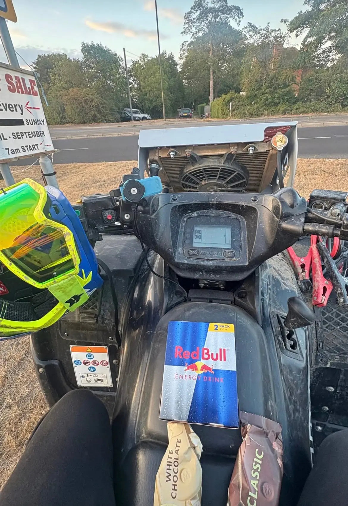 Red bull energy drink can on black kawasaki brute force 750 atv handlebar featuring heavy-duty radiator relocation kit