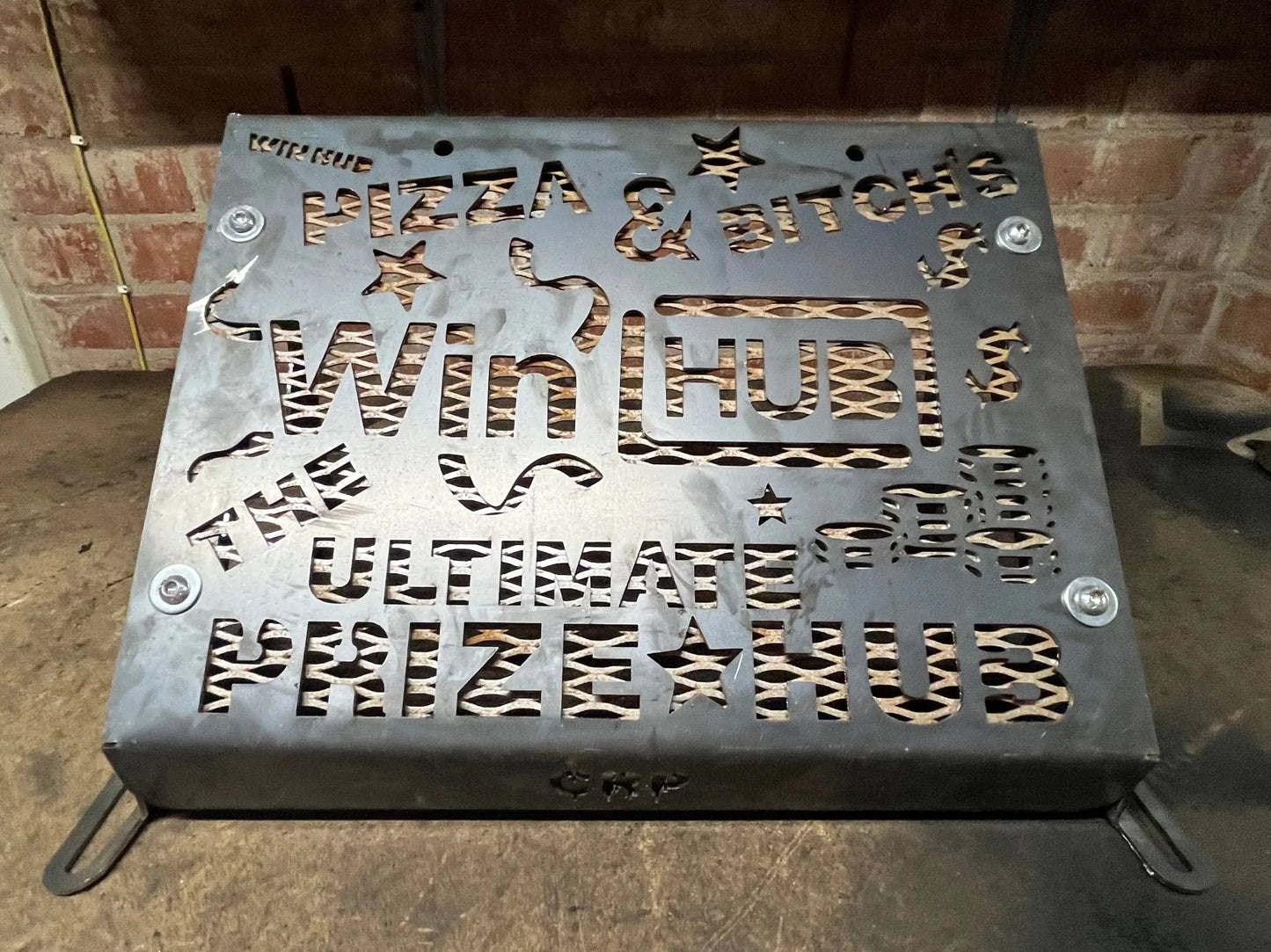 Metallic gray steel heavy-duty radiator relocation kit for kawasaki brute force 750 with cut-out lettering and stars