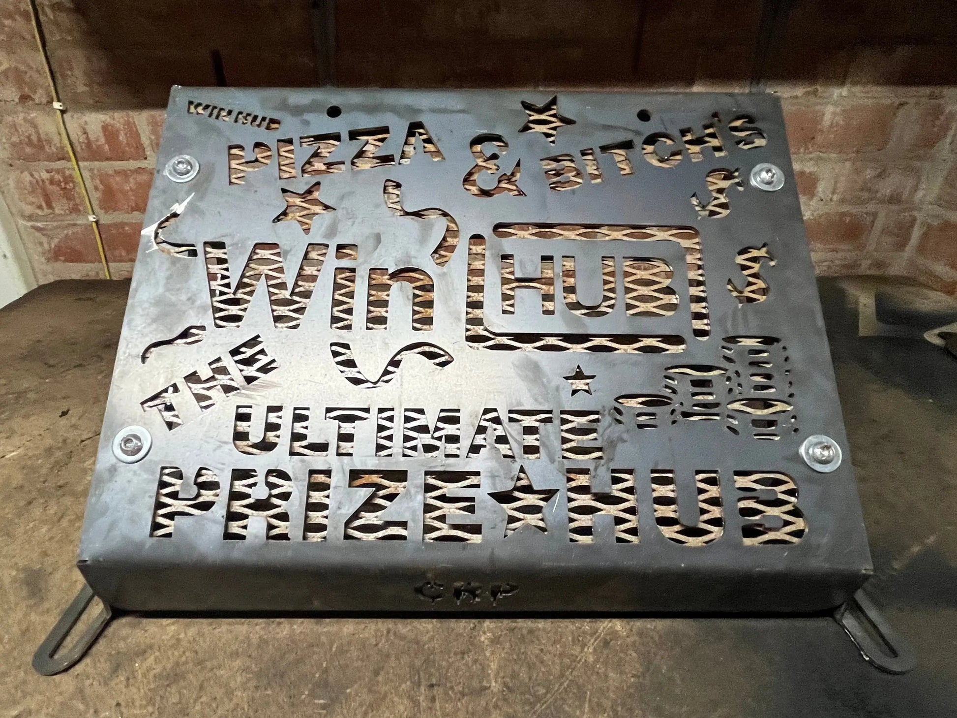 Metallic gray steel heavy-duty radiator relocation kit for kawasaki brute force 750 with cut-out lettering and stars