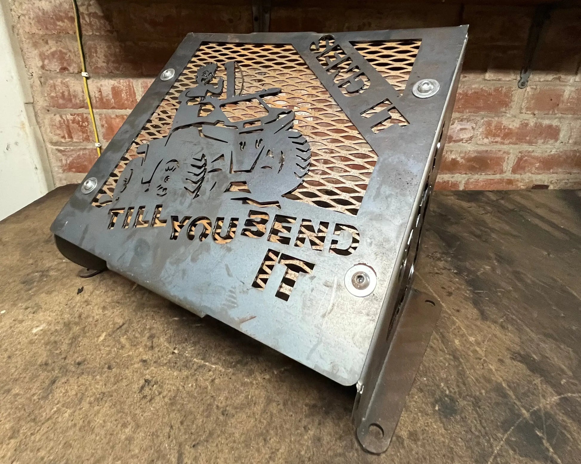 Metallic gray laser-cut steel plaque with tractor silhouette and bold phrase for suzuki kingquad radiator kit