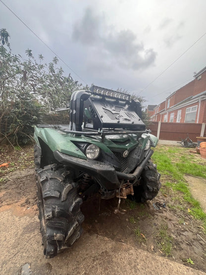Green Yamaha yzfr 600 ATV with black off-road tires and rugged front bumper featured with heavy-duty radiator relocation kit