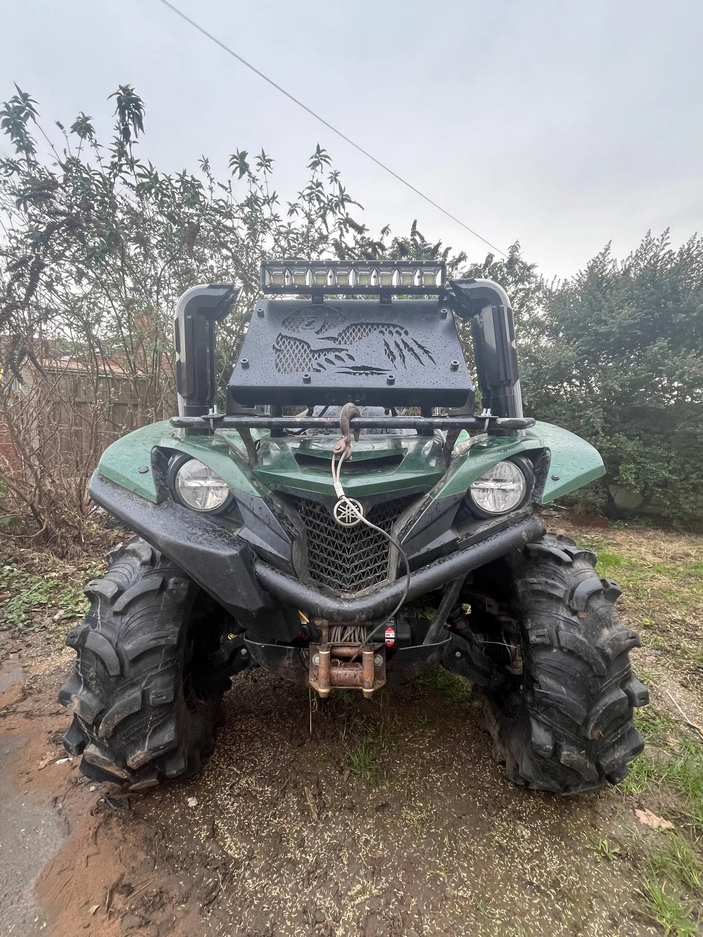 Green yamaha yfz450 atv with black tires and led light bar shown with heavy-duty radiator relocation kit for grizzly 550