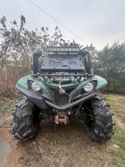 Green yamaha yfz450 atv with black tires and led light bar shown with heavy-duty radiator relocation kit for grizzly 550