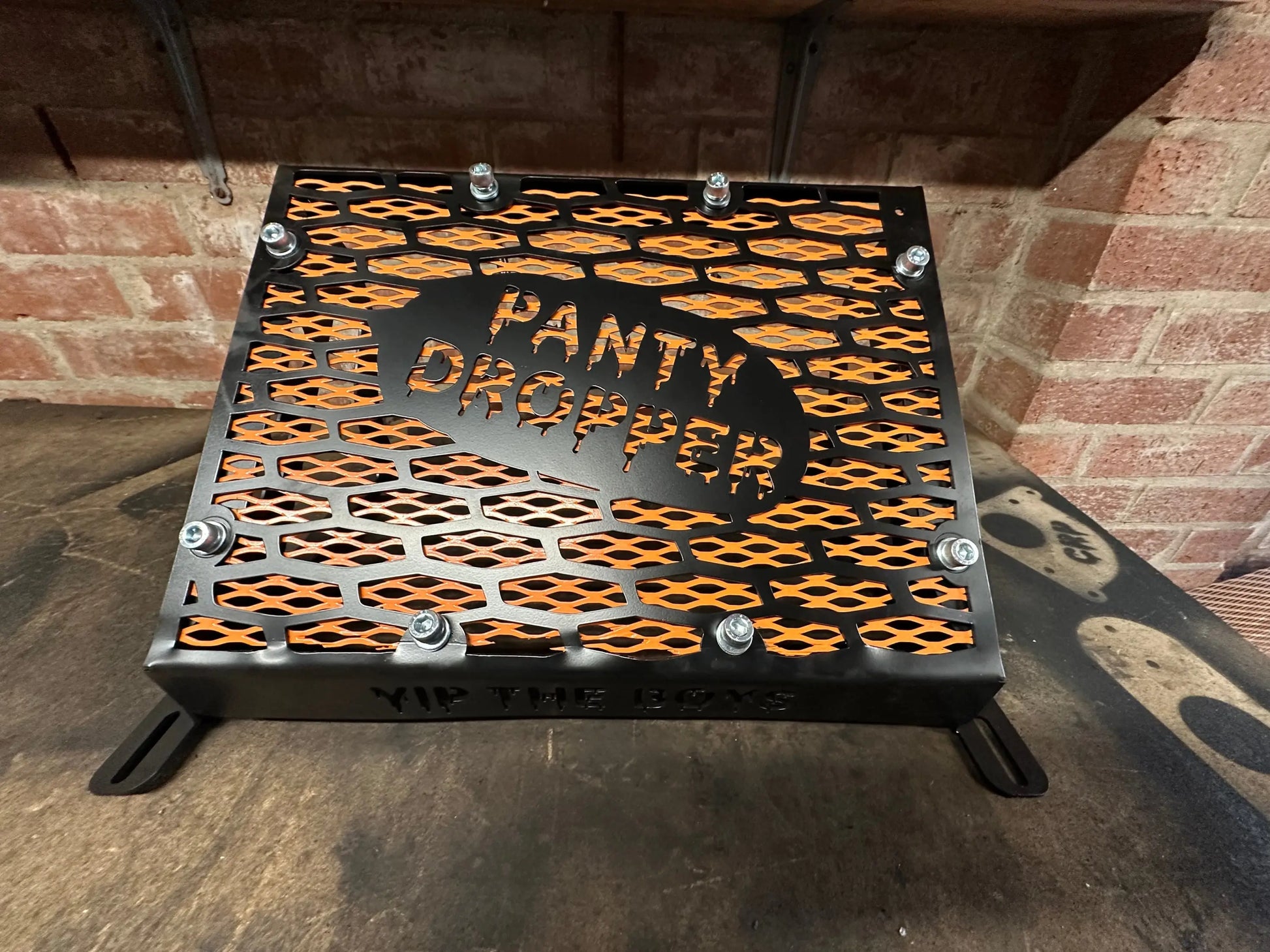 Yamaha Grizzly 550 700 radiator relocation kit black metal grate with orange hexagonal cutouts and panty dropper engraving