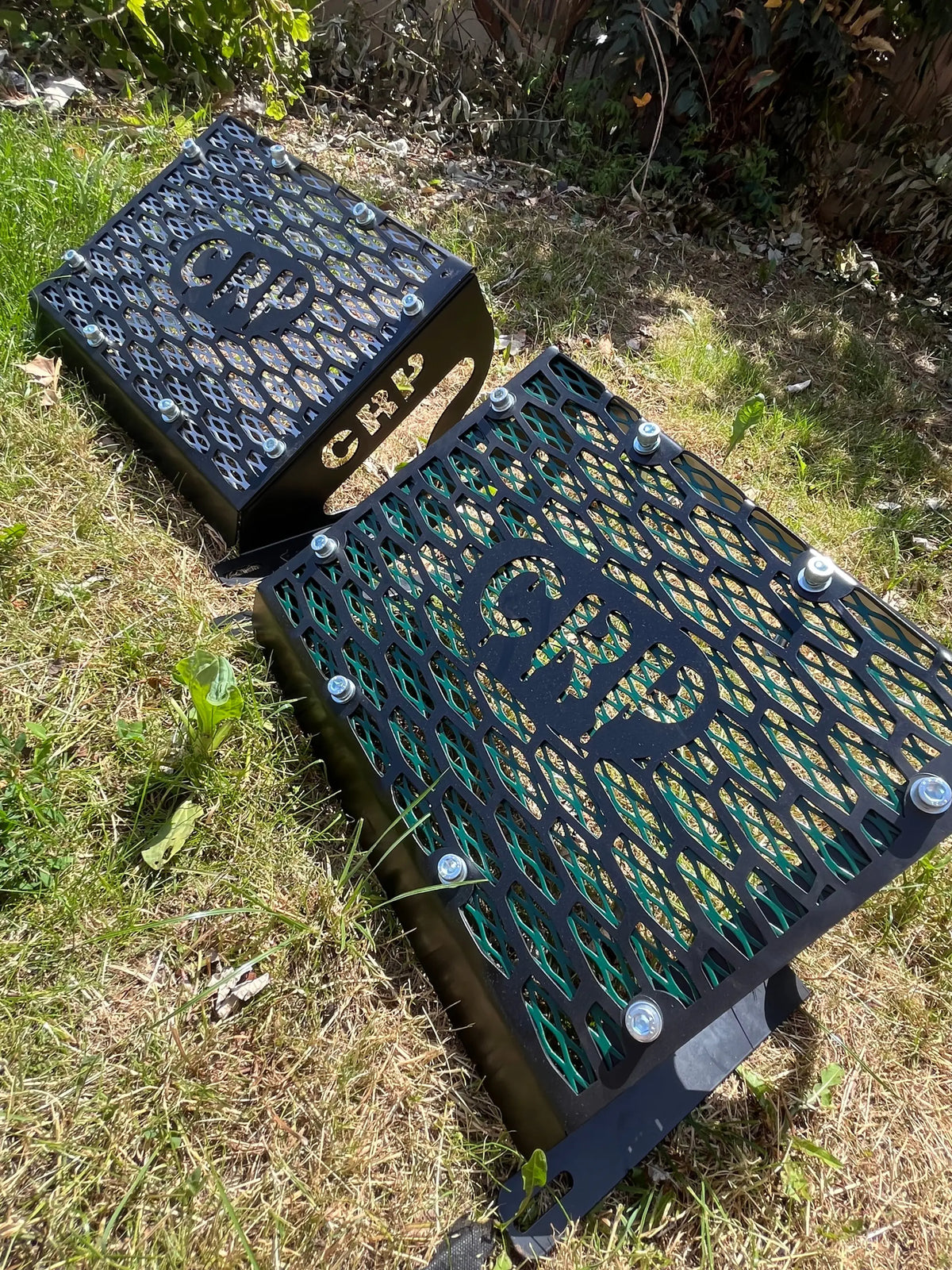 Black metal honeycomb grates with crp logo and silver bolts for yamaha grizzly 550 700 radiator relocation kit