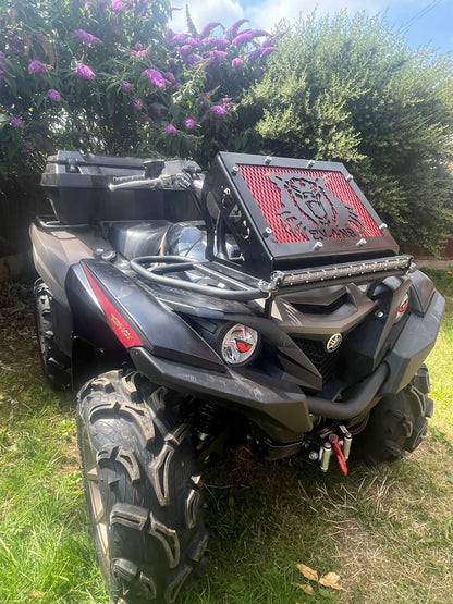 Black and red can-am outlander atv with rugged tires and front grille shown with yamaha grizzly kodiak 700 radiator relocation kit